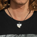 tiger shark tooth necklace on a young man