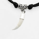 Front view of real crocodile tooth necklace in carved stainless steel