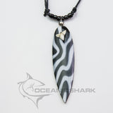 shark tooth necklace surfer