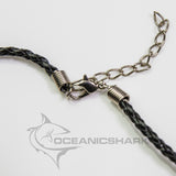 shark tooth necklace on black leather cord