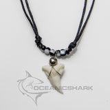 Black and white yin-yang bead shark tooth necklace with a real Blue Shark tooth on an adjustable black cord.
